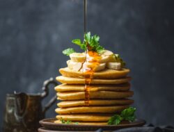 Sweet Delight: Drizzling honey over perfect pancakes